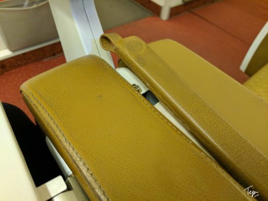 a close up of a yellow leather case