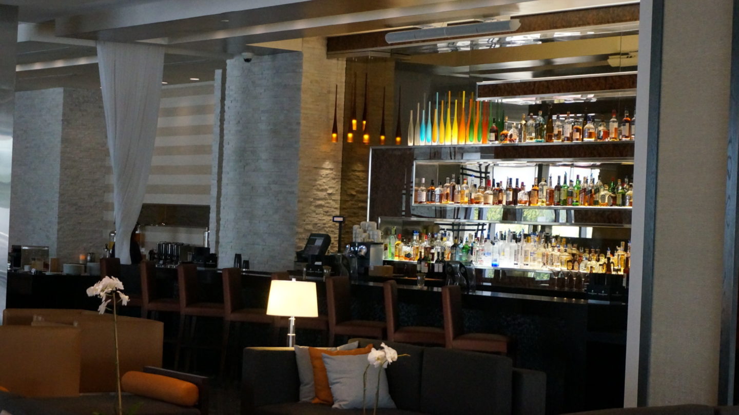 a bar with a shelf of liquor