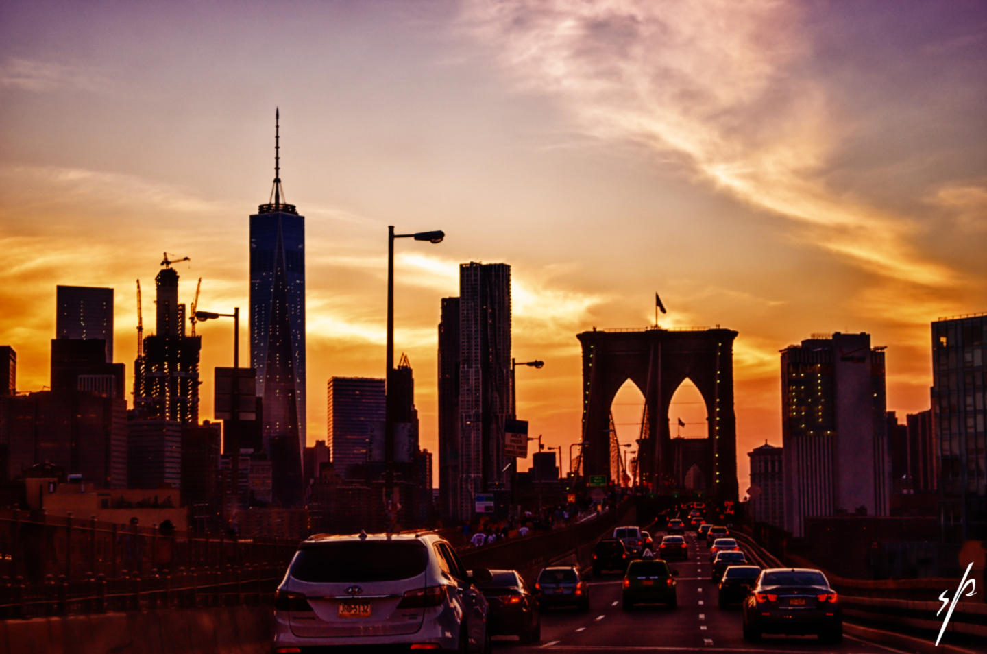 a city with a bridge and a skyscraper