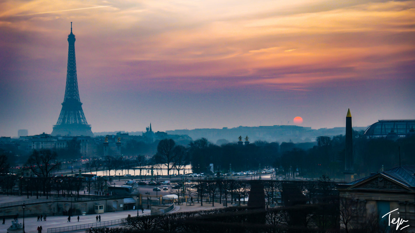 a sunset over a city