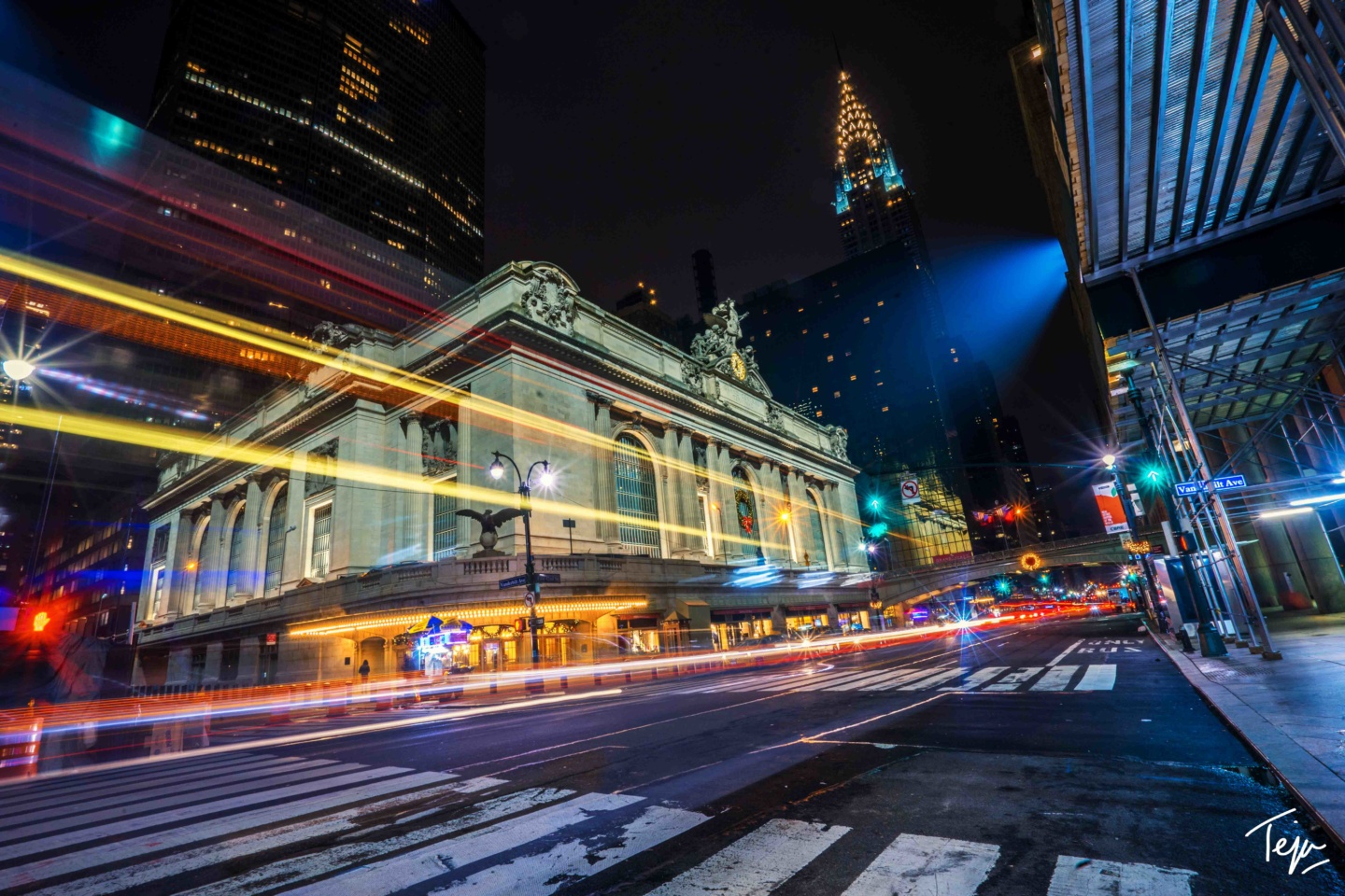 a city street with a building and lights