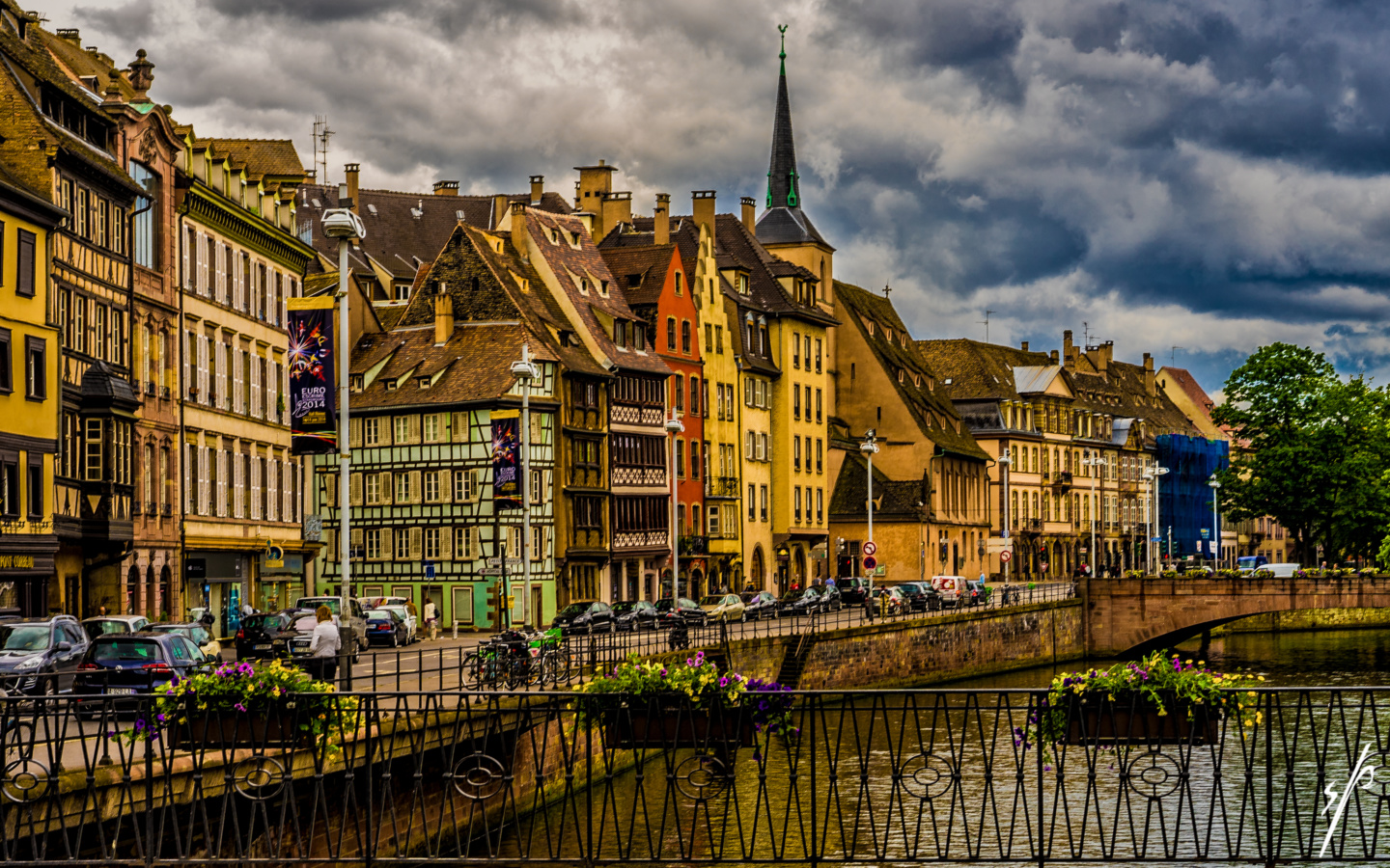 a river with buildings and a bridge
