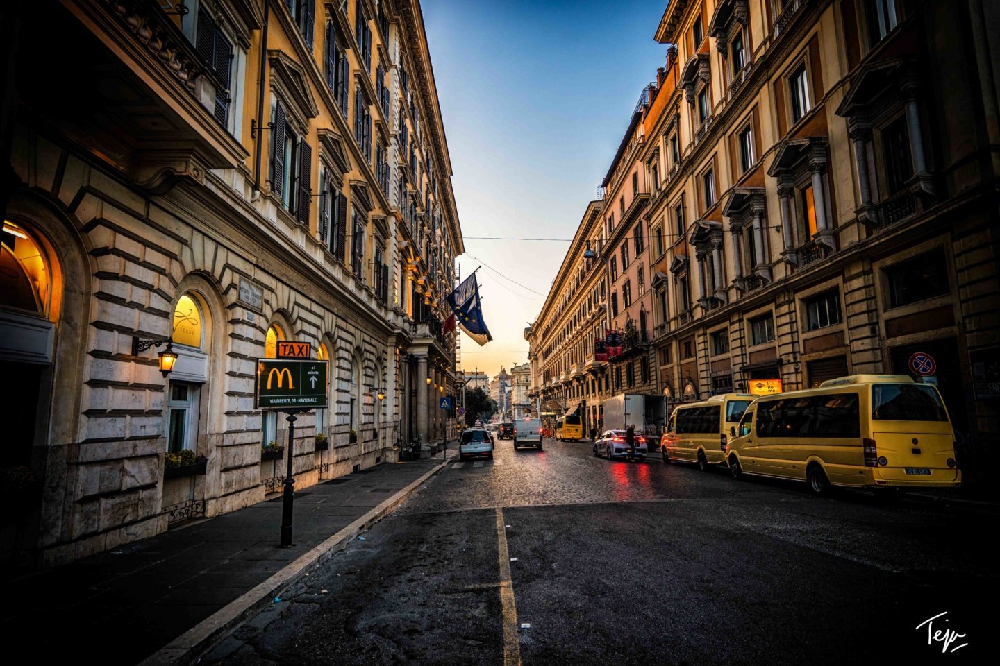 a street with cars and buildings