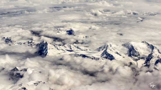 a high angle view of snow covered mountains