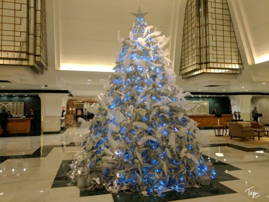 a large christmas tree in a lobby