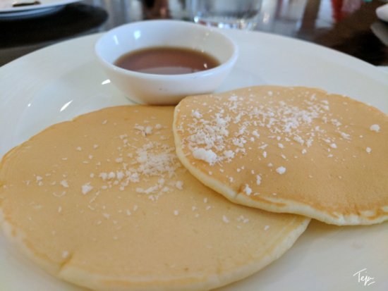 a plate of pancakes with syrup