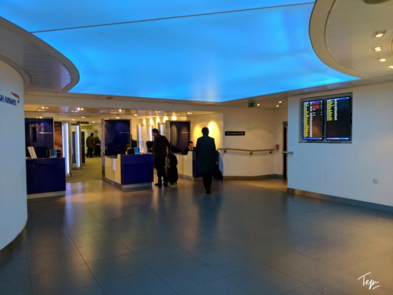 people in a building with blue lights