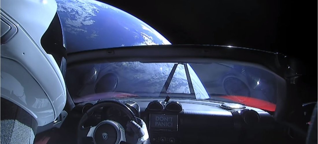 a car with a view of the earth from the windshield
