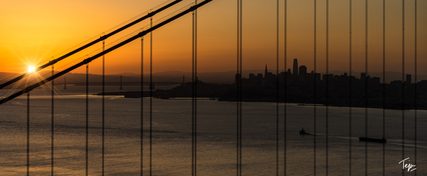 a bridge with a city in the background
