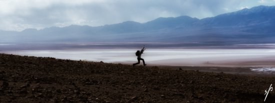 a person running on a dirt field