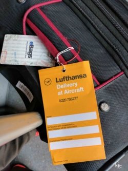a luggage bag with a tag