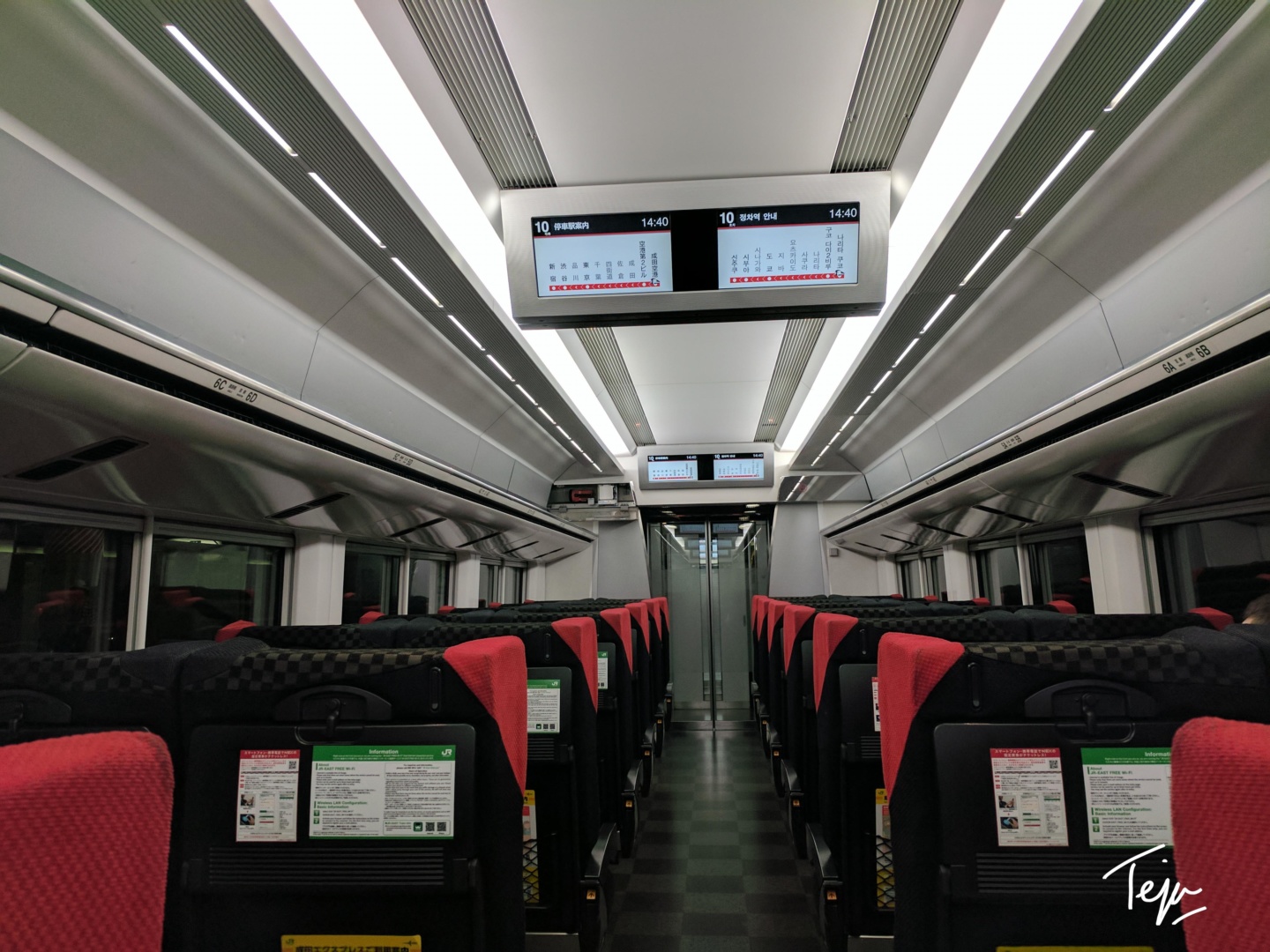 a train with seats and a screen