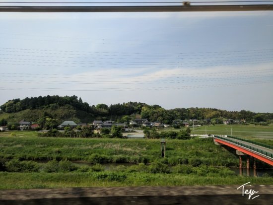 a view of a landscape from a train window