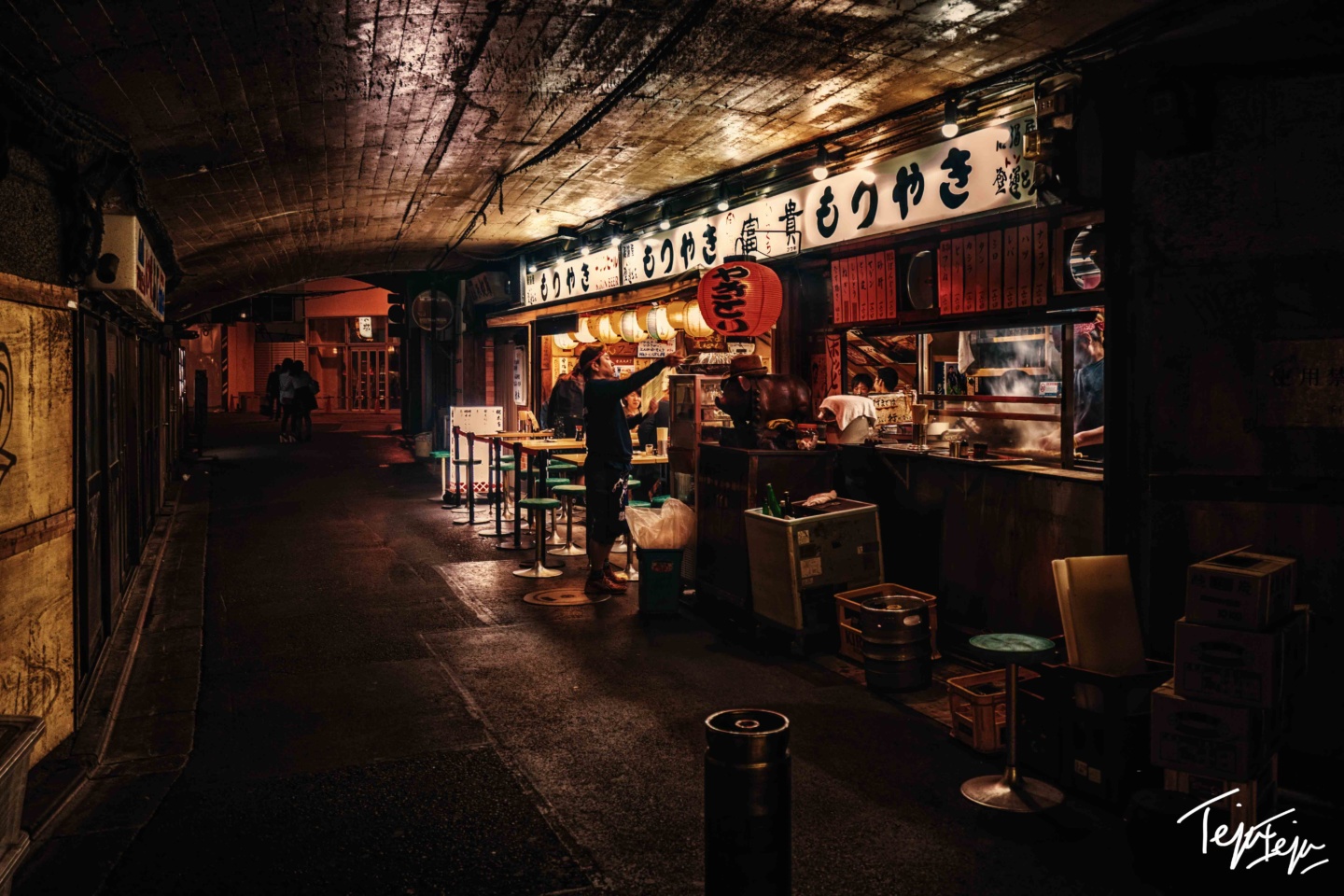 a man standing at a restaurant
