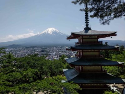a pagoda with Mount Fuji in the background