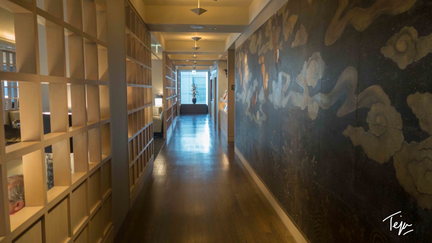 a hallway with a wall painting