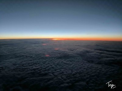 a view of the sun from above the clouds