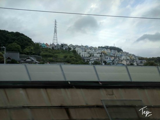 a view of a city from a train
