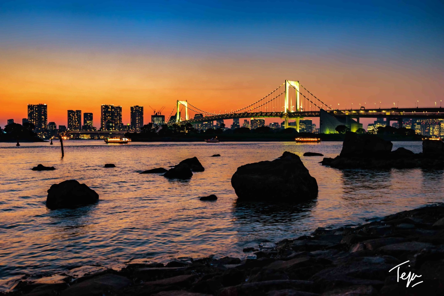 a city skyline and a body of water