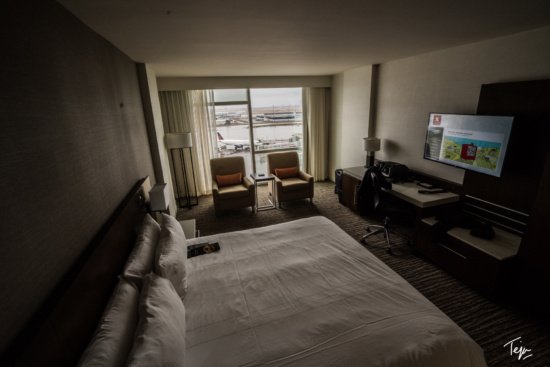 a room with a large bed and a television