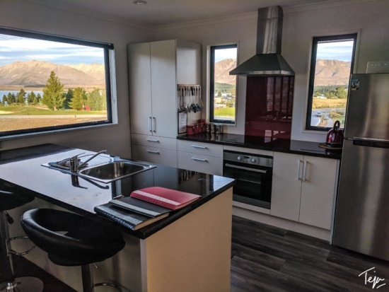 a kitchen with a view of the mountains