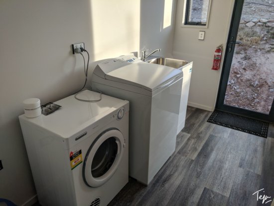 a washing machine and washer in a room