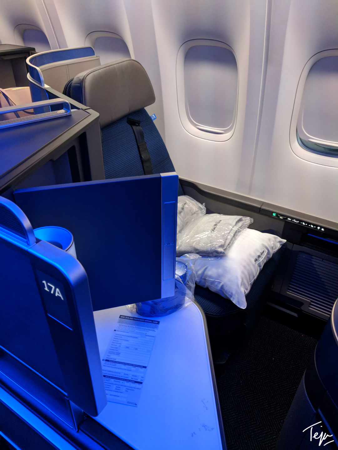 a computer on the seat of an airplane