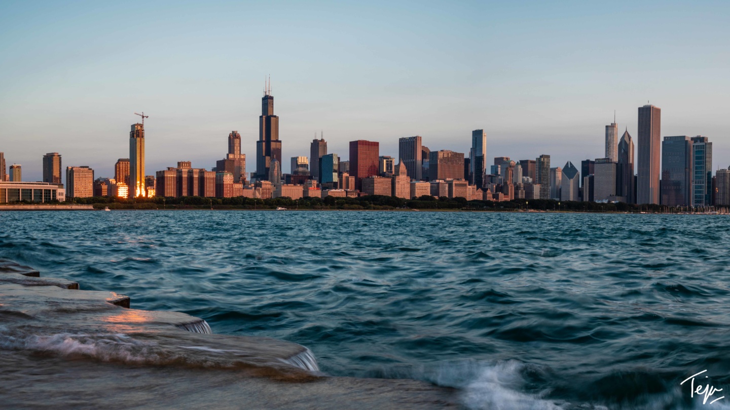 a city skyline with water and a body of water