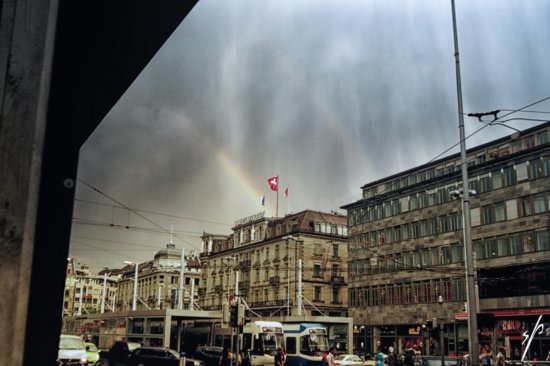 a rainbow over a city