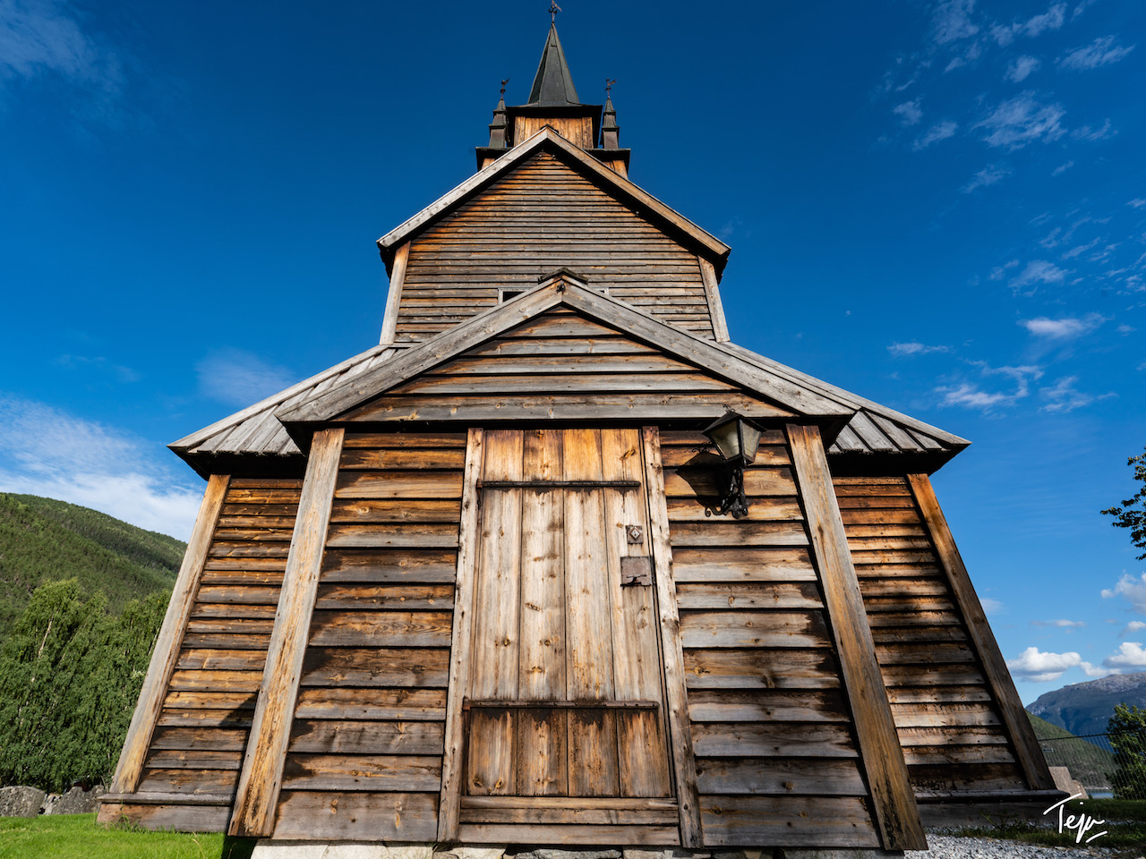 a wooden church with a steeple