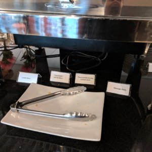 a plate with tongs on it