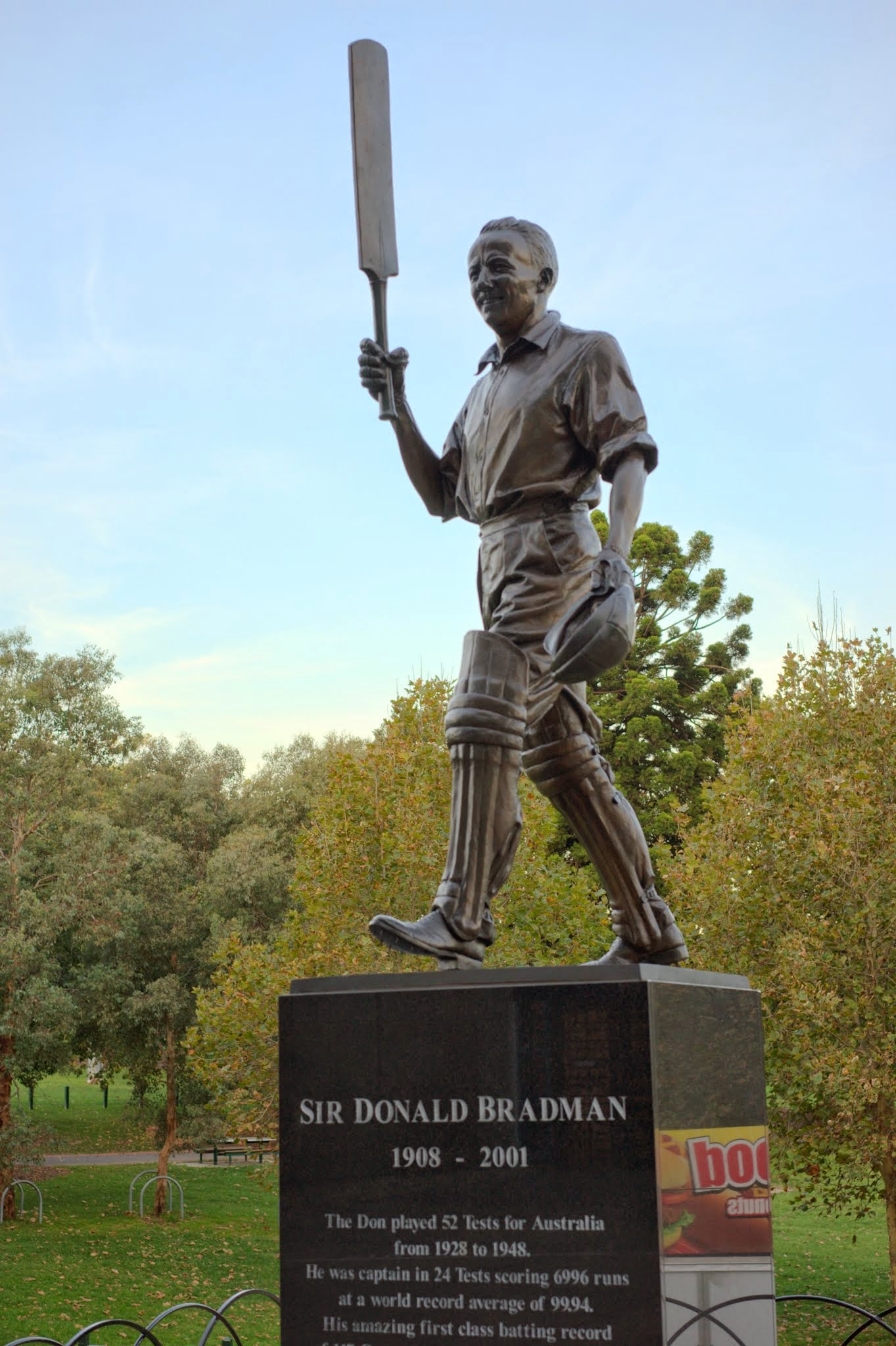 a statue of a man holding a bat