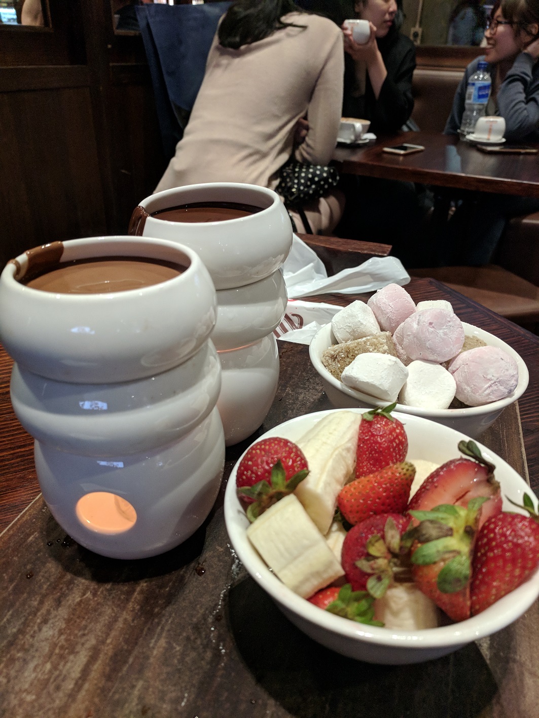 a bowl of fruit and chocolate fondue