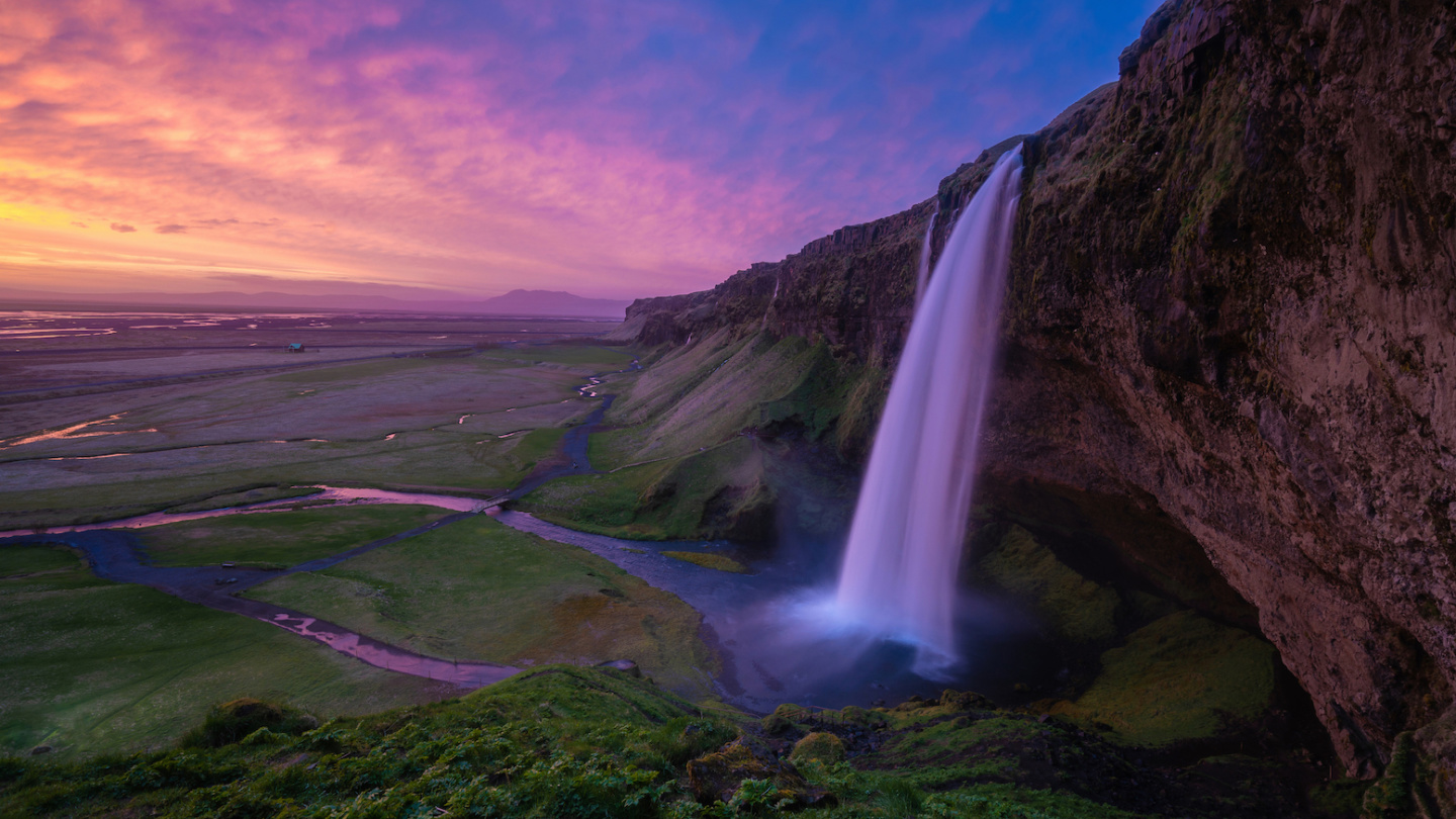 a waterfall over a cliff