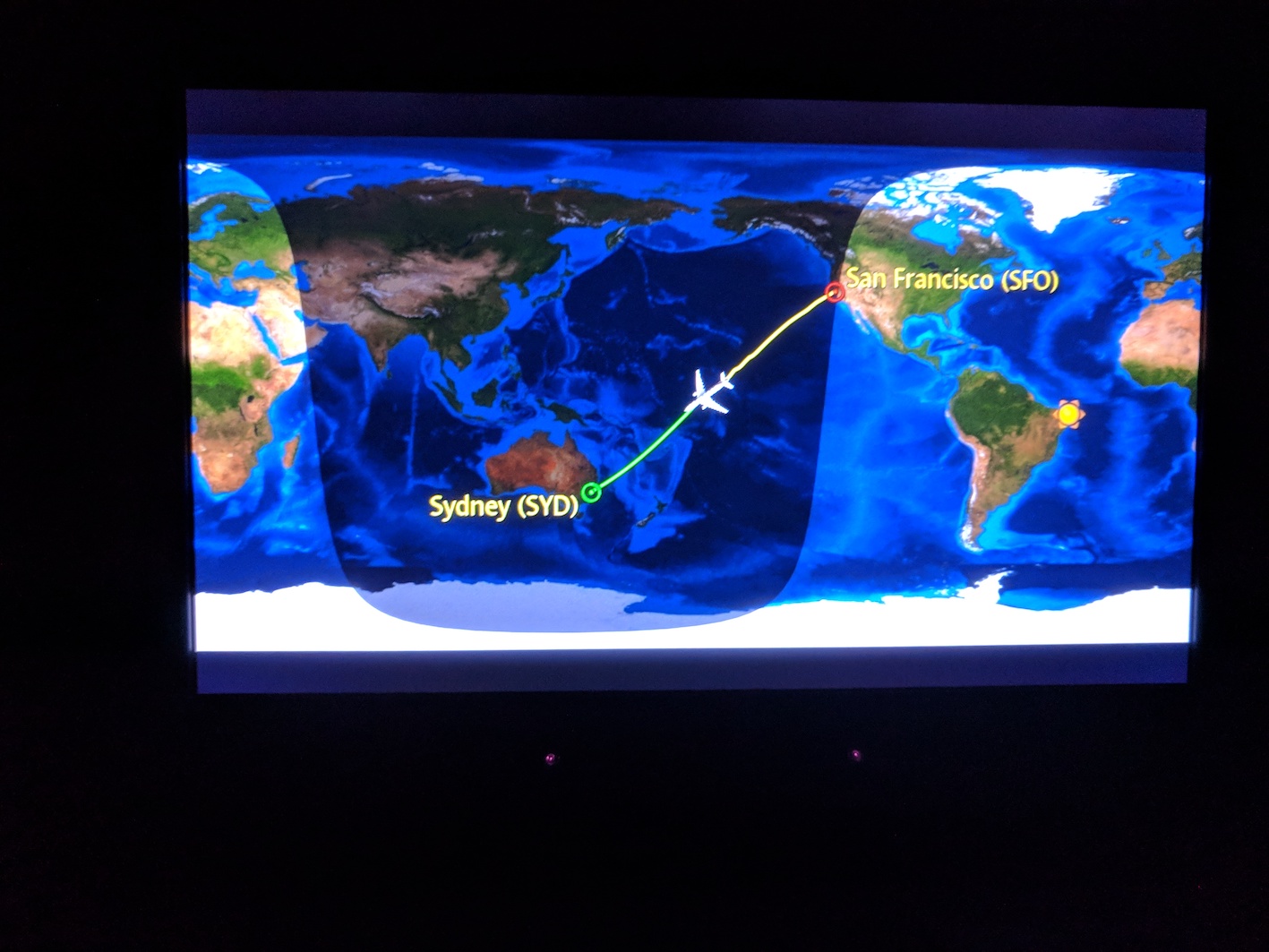 a map of the world with a plane going to san francisco