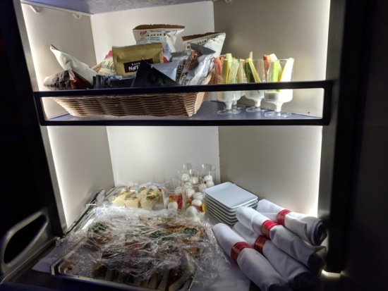 a shelf with food and napkins