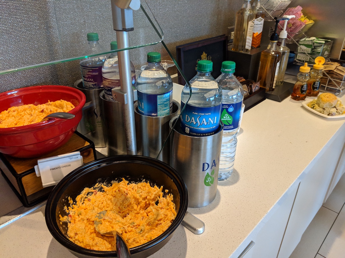 a bowl of food and bottles of water on a counter