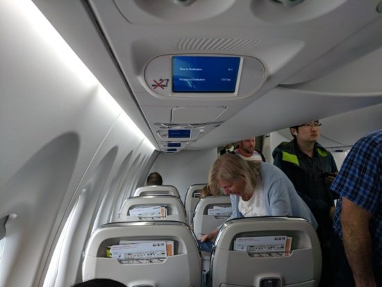 people in an airplane with people on the seats