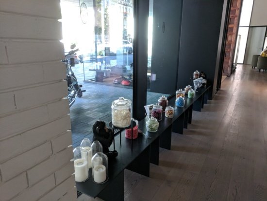 a row of glass jars on a shelf