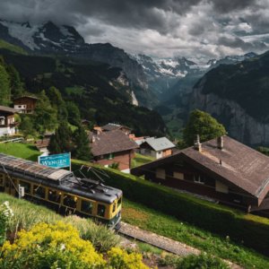 a train on a train track in a village