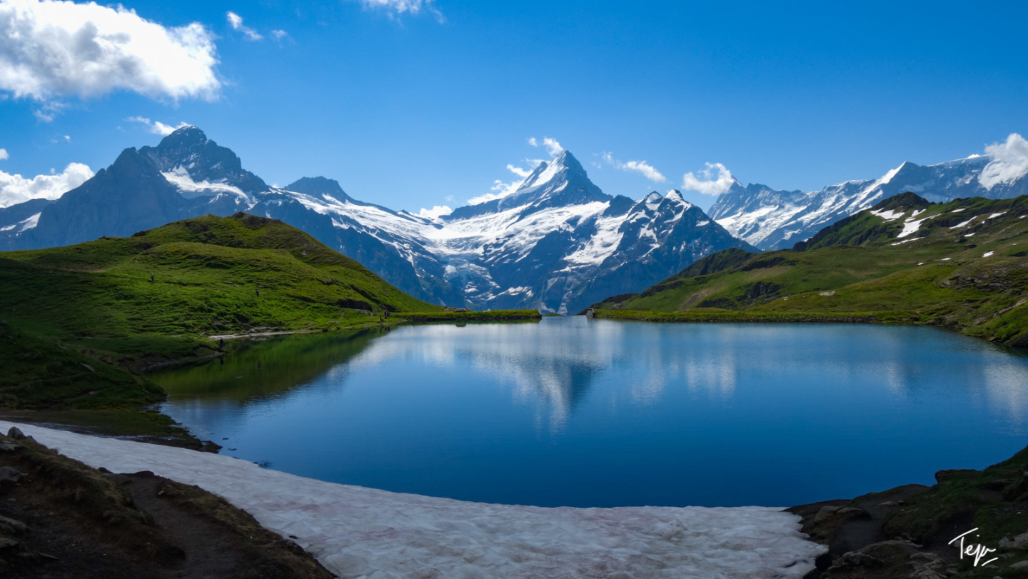 a lake surrounded by mountains