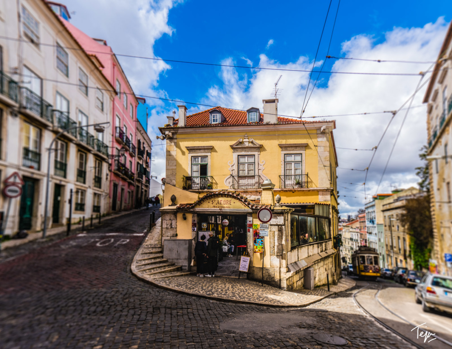 a street with buildings and a yellow building