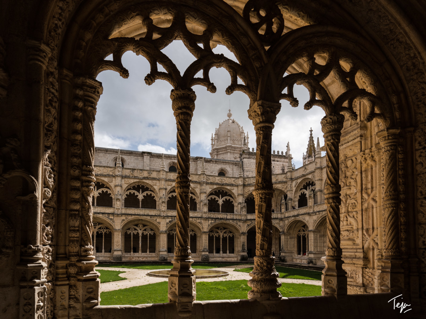 a large stone building with a courtyard and a dome