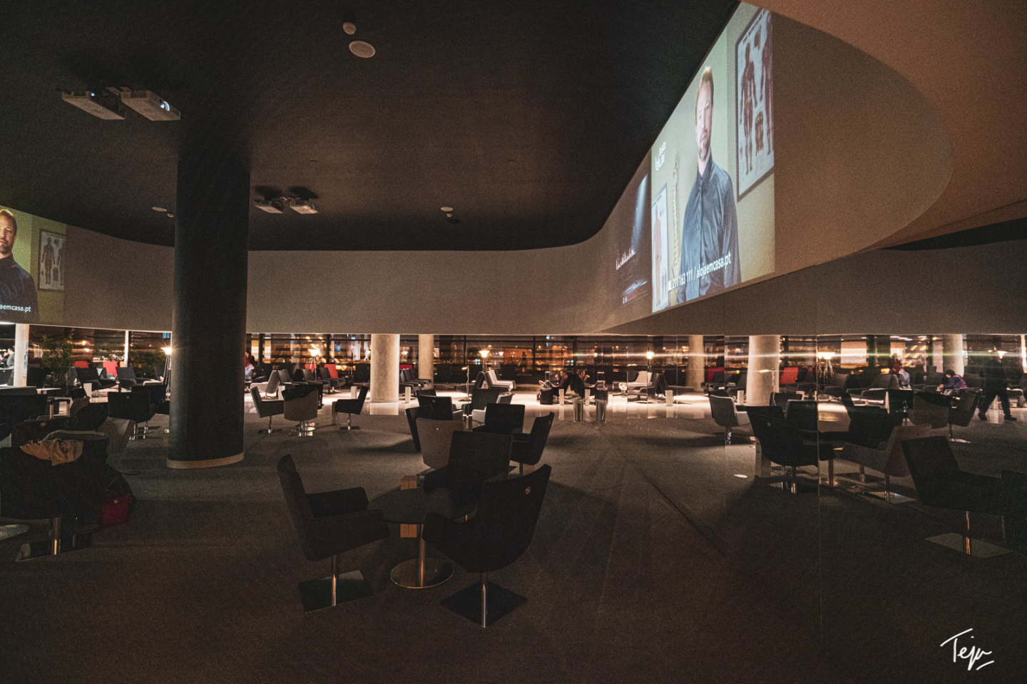 a large room with a large projector screen