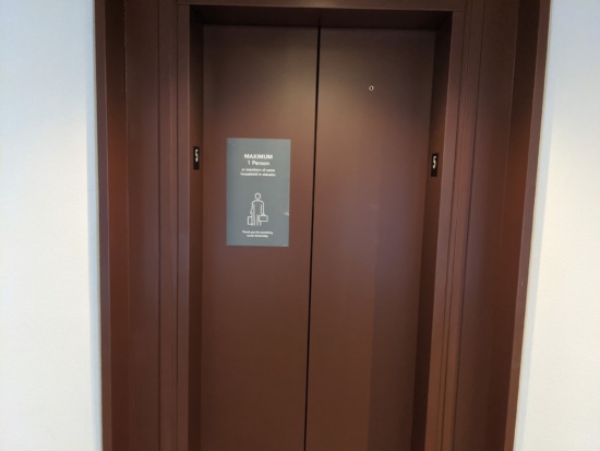 a elevator door with a sign
