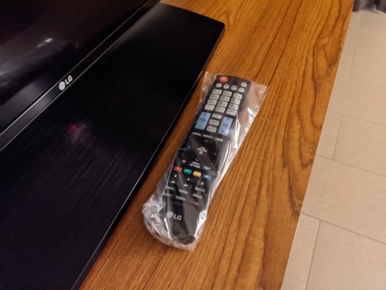 a remote control in a plastic wrap
