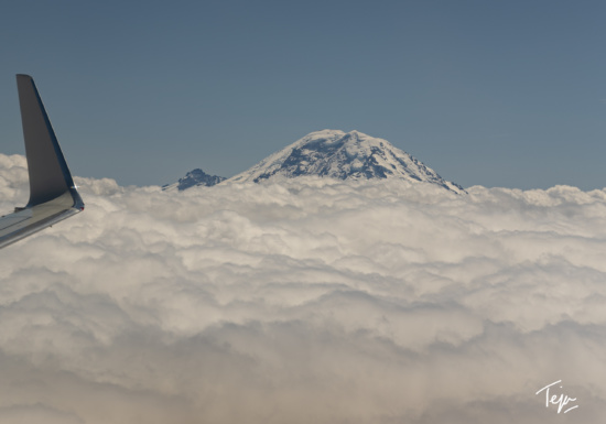 a mountain above the clouds