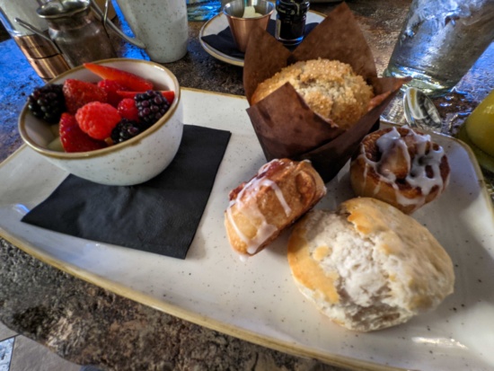 a plate of pastries and fruit