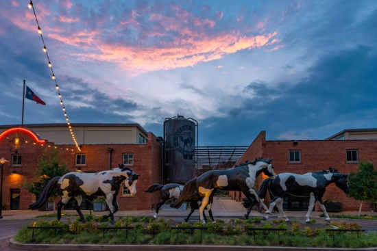a group of horses statues in front of a building