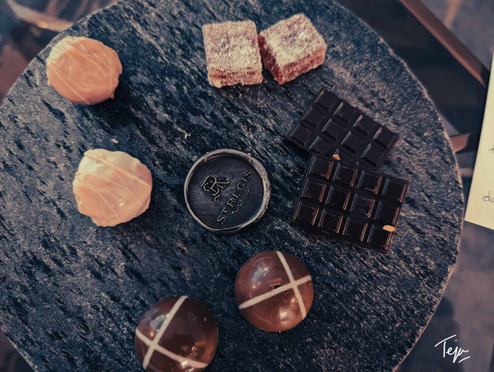 a group of chocolates and a round object on a table